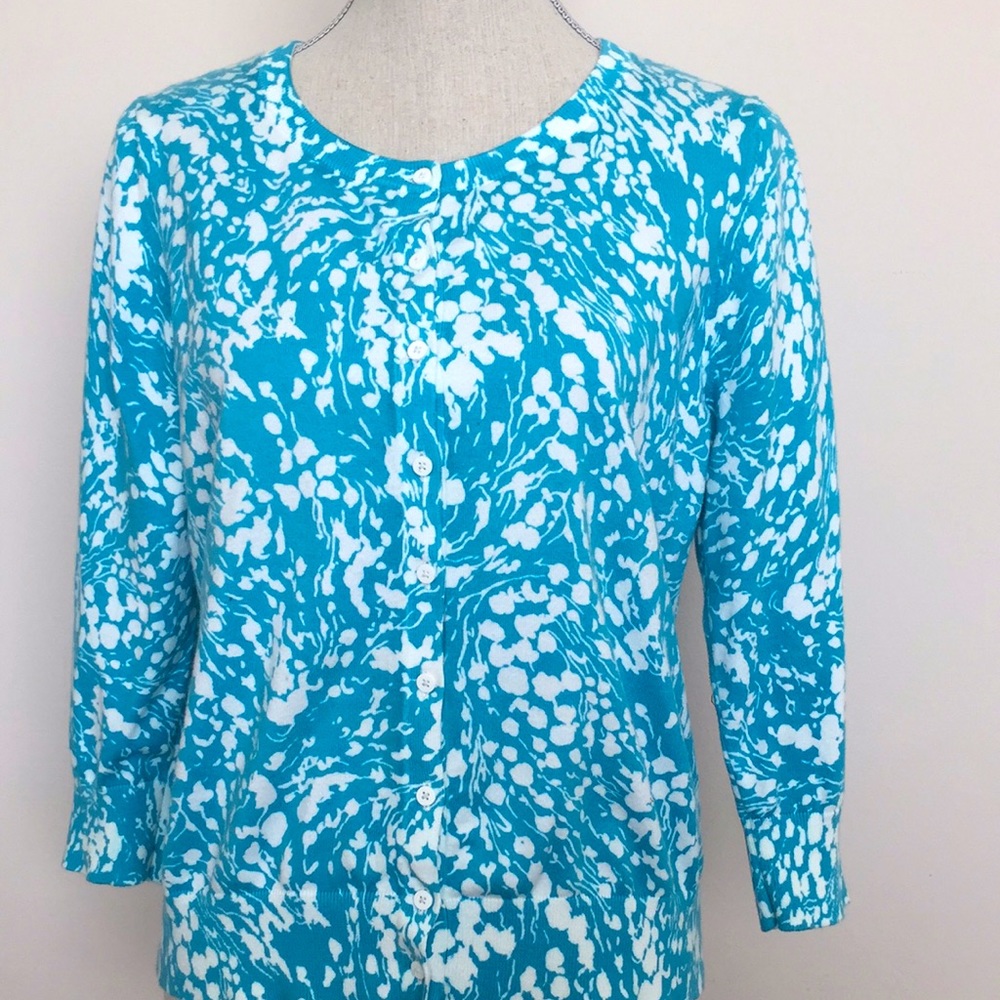 Striking aqua blue with white floral pattern.